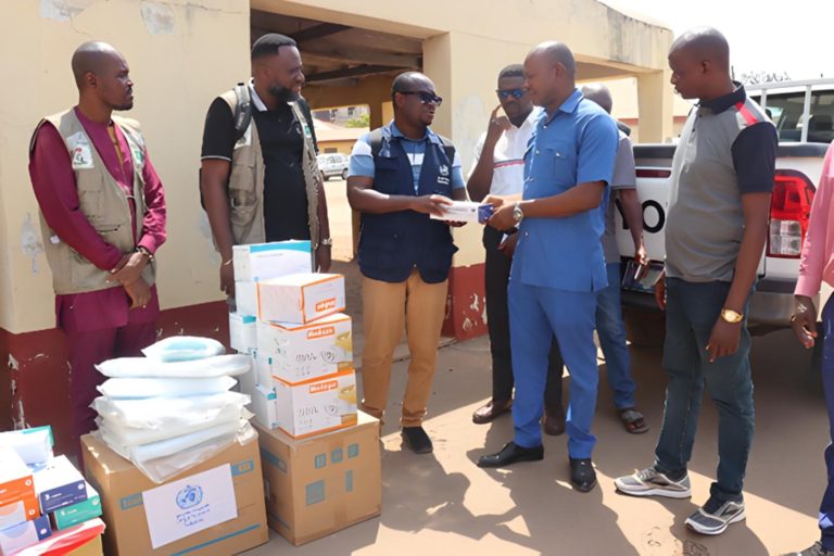 WHO and NCDC staff handing over some of the donated Infection prevention and control commodities to a health facility in Benue State